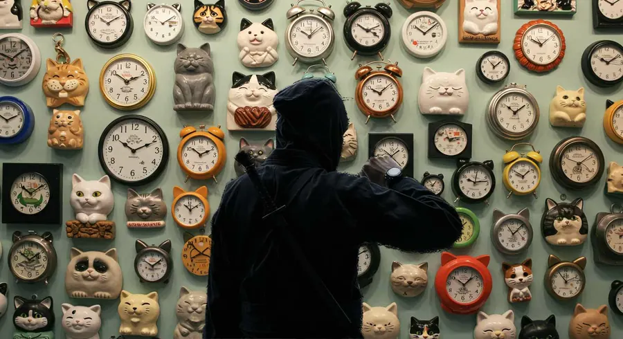 Ninja in front of a wall of clocks